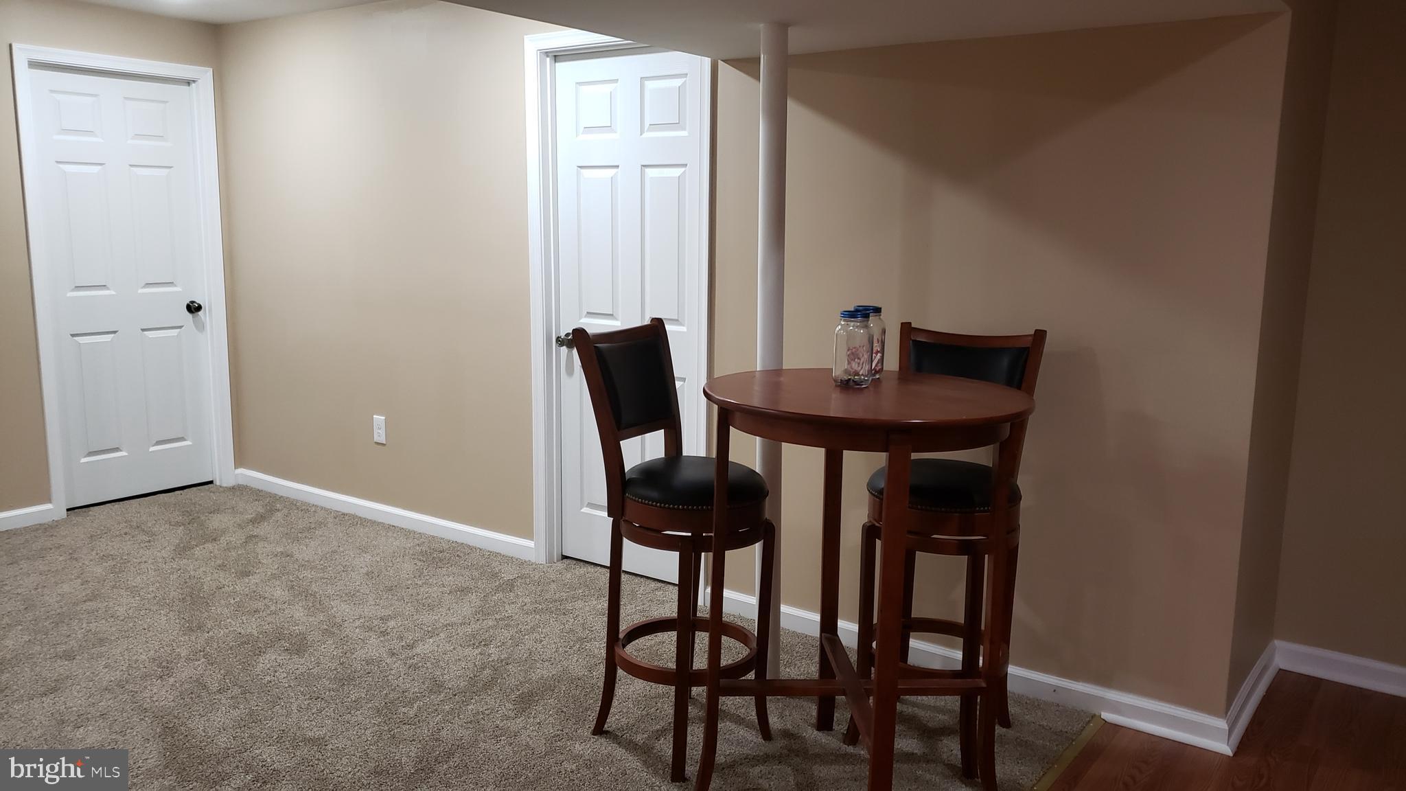 8637 Willow Run Road Baltimore, MD 21244 - Photo 46 of 56 a view of a room with a table and chairs