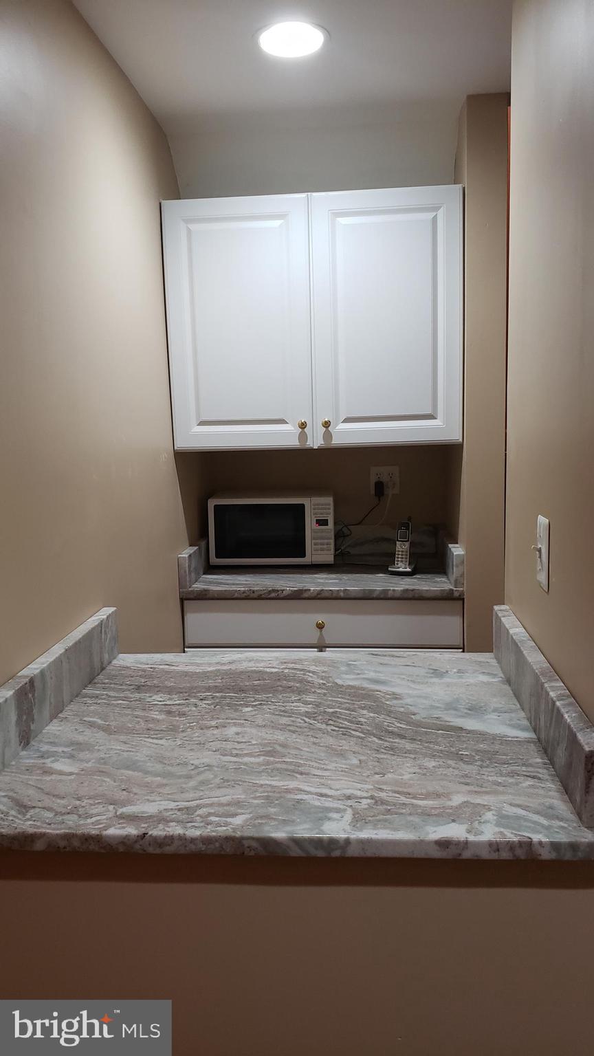 8637 Willow Run Road Baltimore, MD 21244 - Photo 49 of 56 a view of room with wooden floor