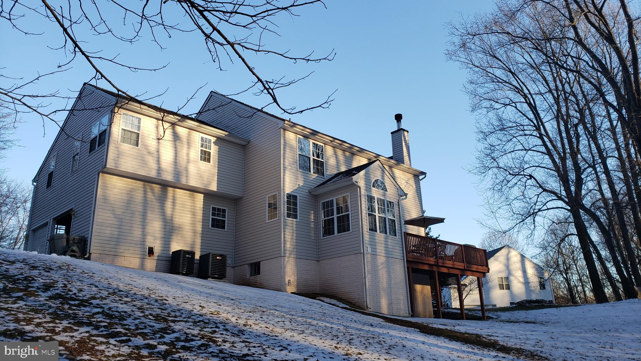 8637 Willow Run Road Baltimore, MD 21244 - Photo 10 of 56 a view of a house with a snow
