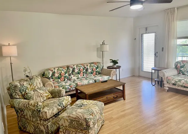 a bedroom with furniture and a wooden floor