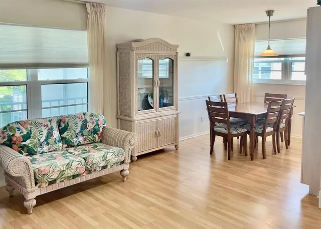 a view of a dining room with furniture and window