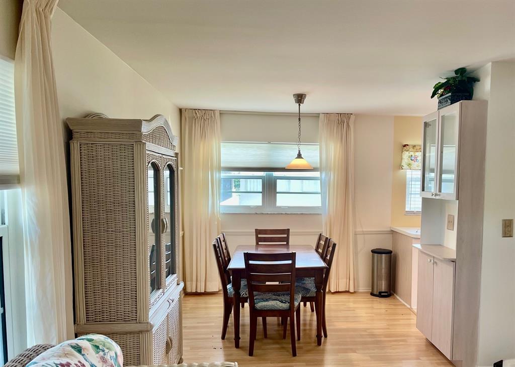 35 Pine Arbor Lane, Unit 202 Vero Beach, FL 32962 - Photo 7 of 16 a view of a dining room with furniture and window