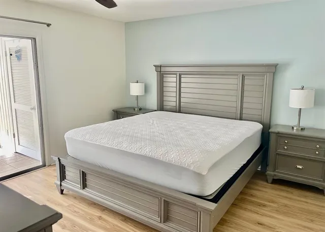 a bedroom with a bed and a dresser