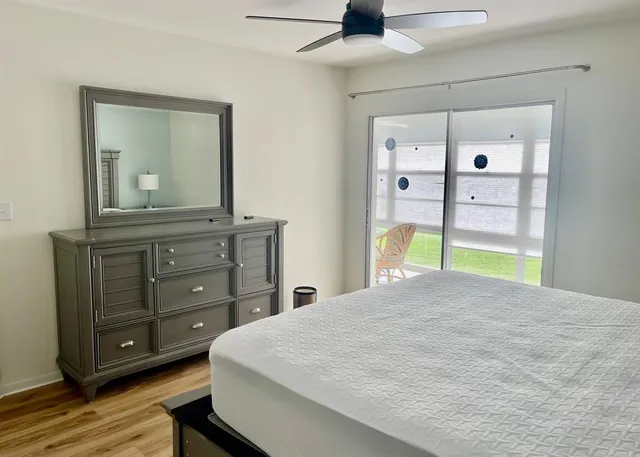 a bedroom with furniture and a window