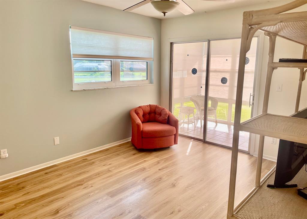 35 Pine Arbor Lane, Unit 202 Vero Beach, FL 32962 - Photo 10 of 16 a bedroom with furniture and a window