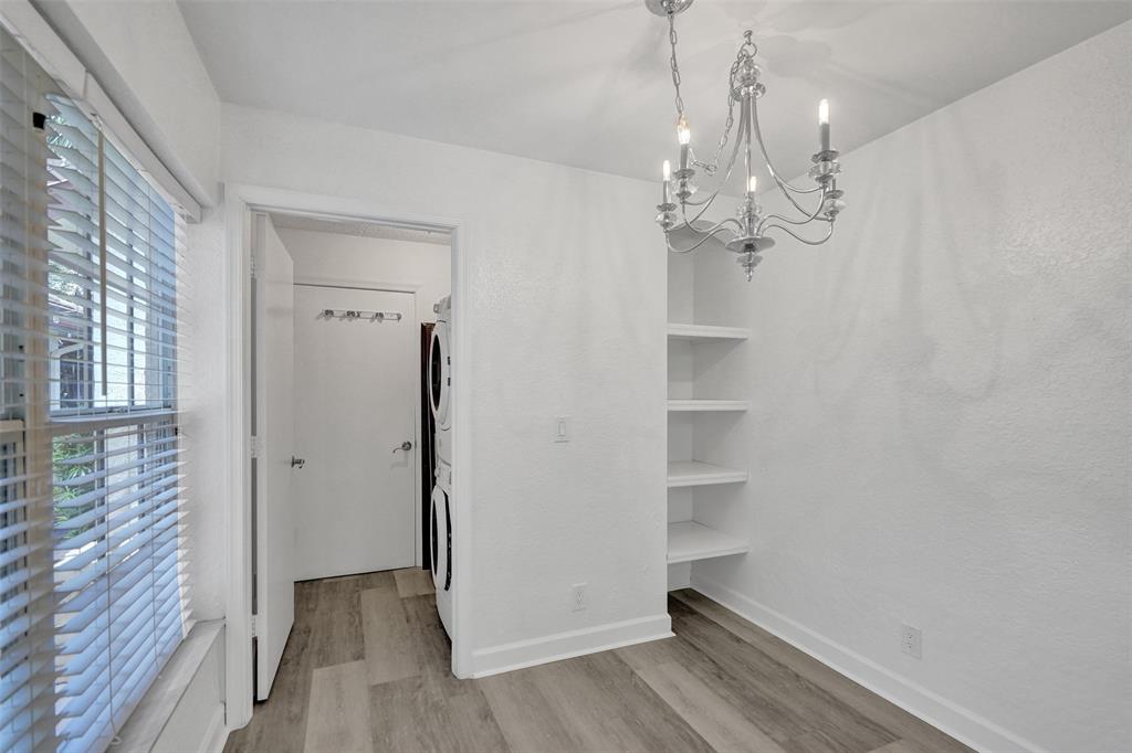 11652 Northwest 19th Drive Coral Springs, FL 33071 - Photo 14 of 52 a view of a chandelier in big room with wooden floor and chandelier