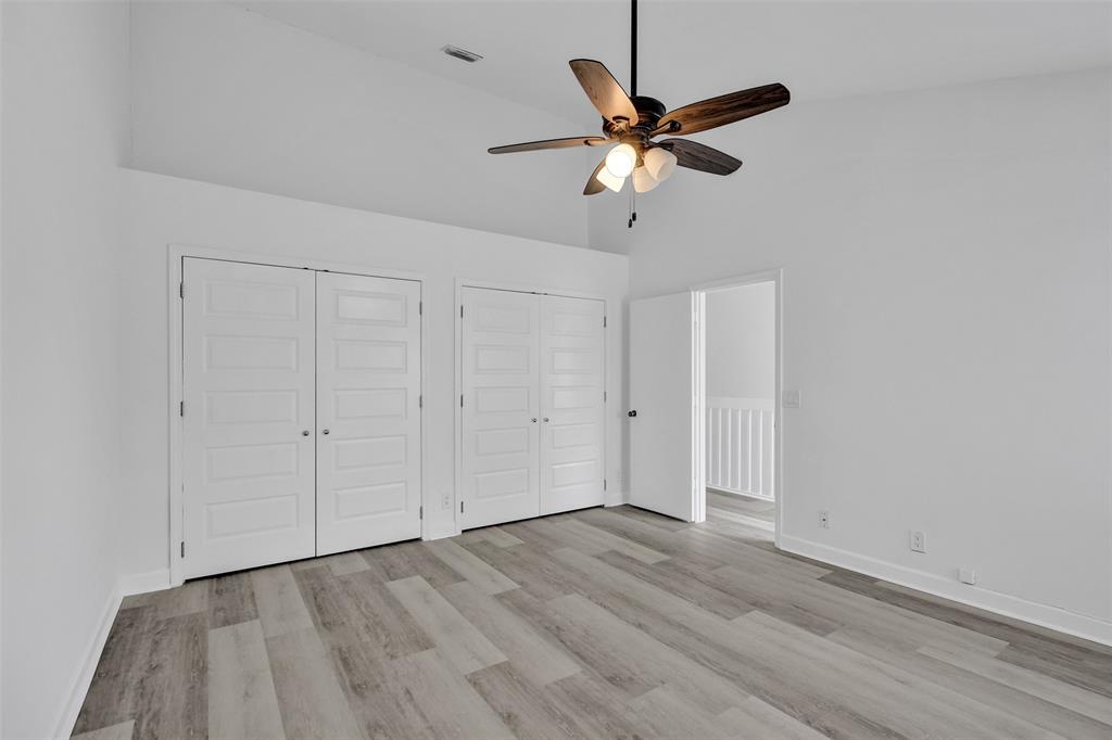 11652 Northwest 19th Drive Coral Springs, FL 33071 - Photo 21 of 52 a view of an empty room with wooden floor