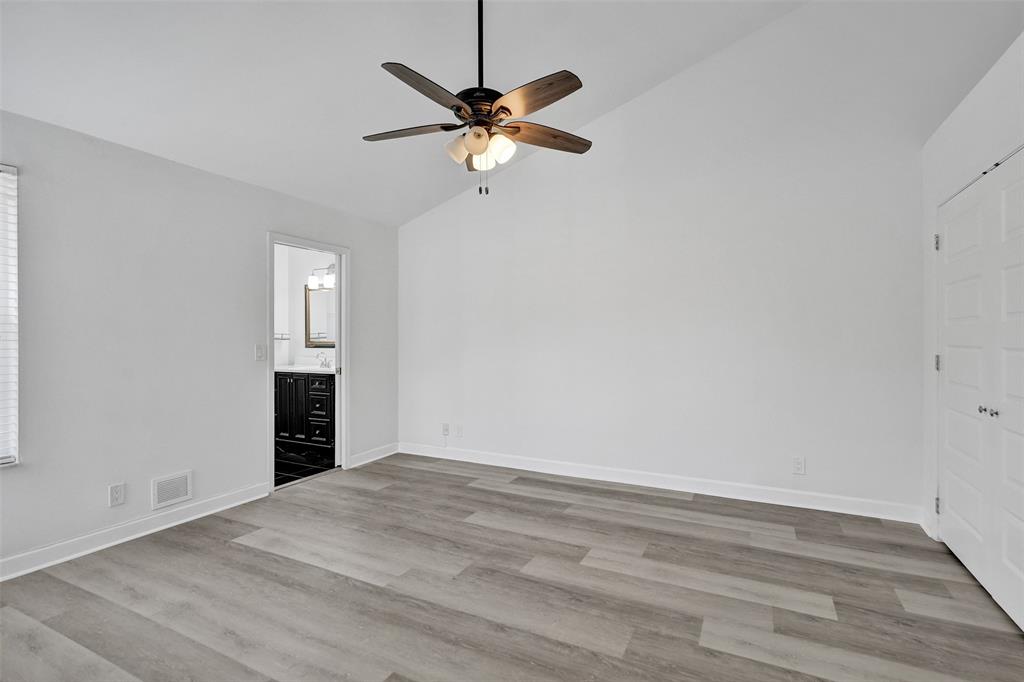 11652 Northwest 19th Drive Coral Springs, FL 33071 - Photo 22 of 52 wooden floor in an empty room with a window