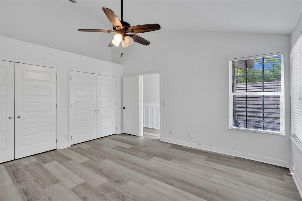 11652 Northwest 19th Drive Coral Springs, FL 33071 - Photo 24 of 52 a view of an empty room with wooden floor and a window
