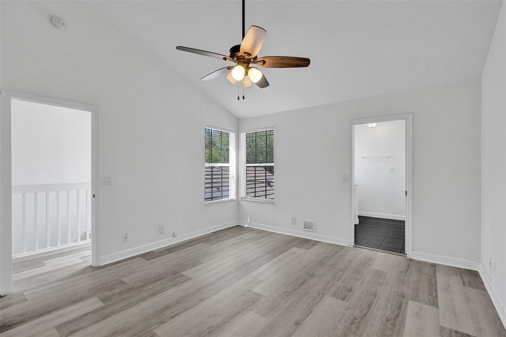 11652 Northwest 19th Drive Coral Springs, FL 33071 - Photo 25 of 52 a view of wooden floor and a chandelier fan in an empty room