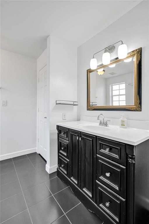 11652 Northwest 19th Drive Coral Springs, FL 33071 - Photo 28 of 52 a bathroom with a sink and a mirror