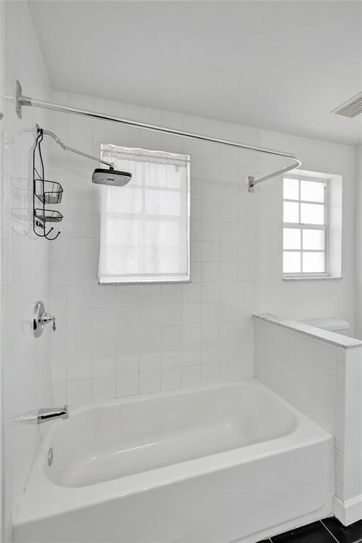 11652 Northwest 19th Drive Coral Springs, FL 33071 - Photo 31 of 52 a white bath tub sitting next to a window