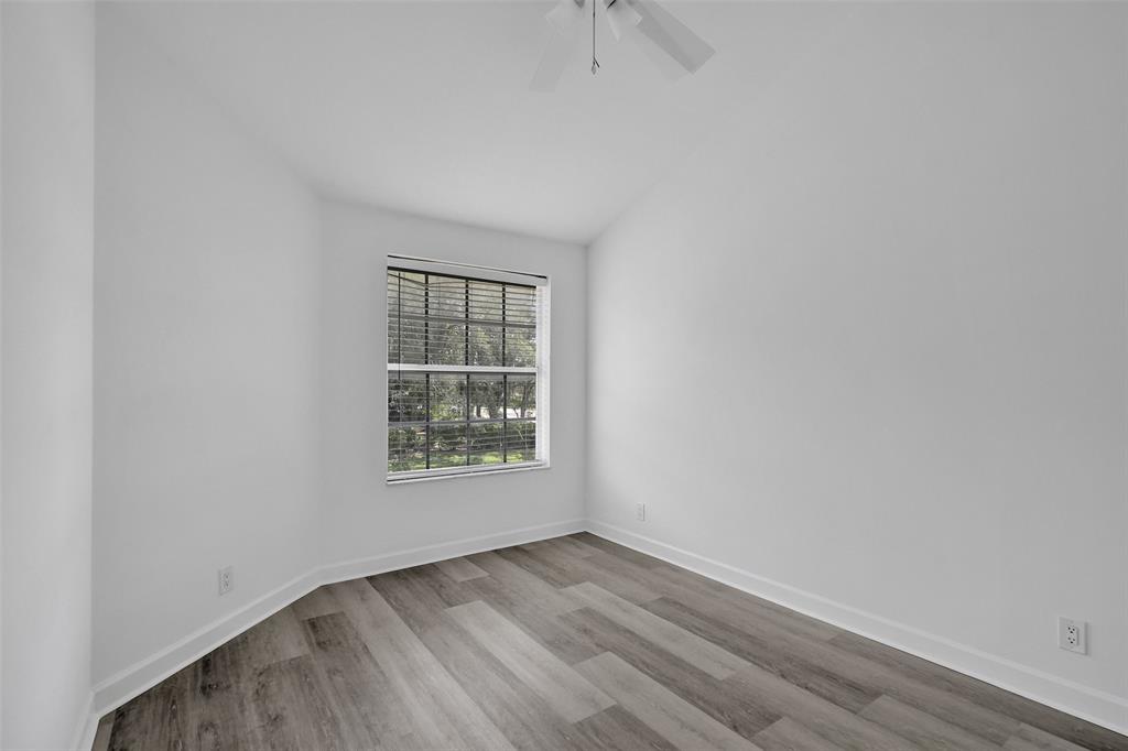 11652 Northwest 19th Drive Coral Springs, FL 33071 - Photo 32 of 52 an empty room with a window