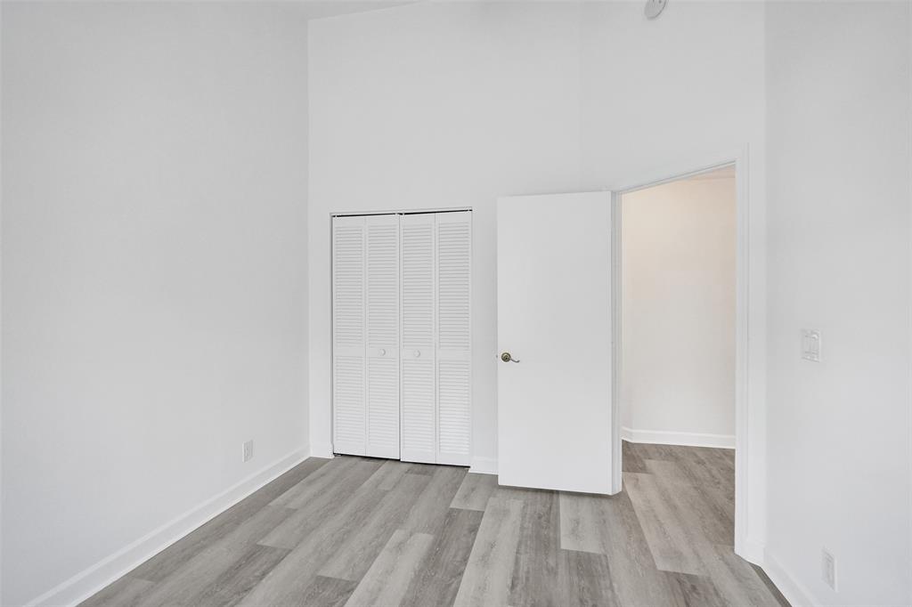 11652 Northwest 19th Drive Coral Springs, FL 33071 - Photo 35 of 52 a view of an empty room with wooden floor