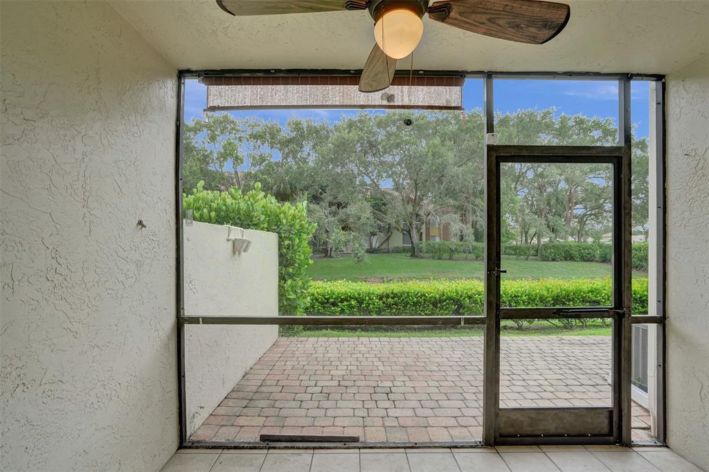 11652 Northwest 19th Drive Coral Springs, FL 33071 - Photo 43 of 52 a view of a floor to ceiling window and a wooden fence