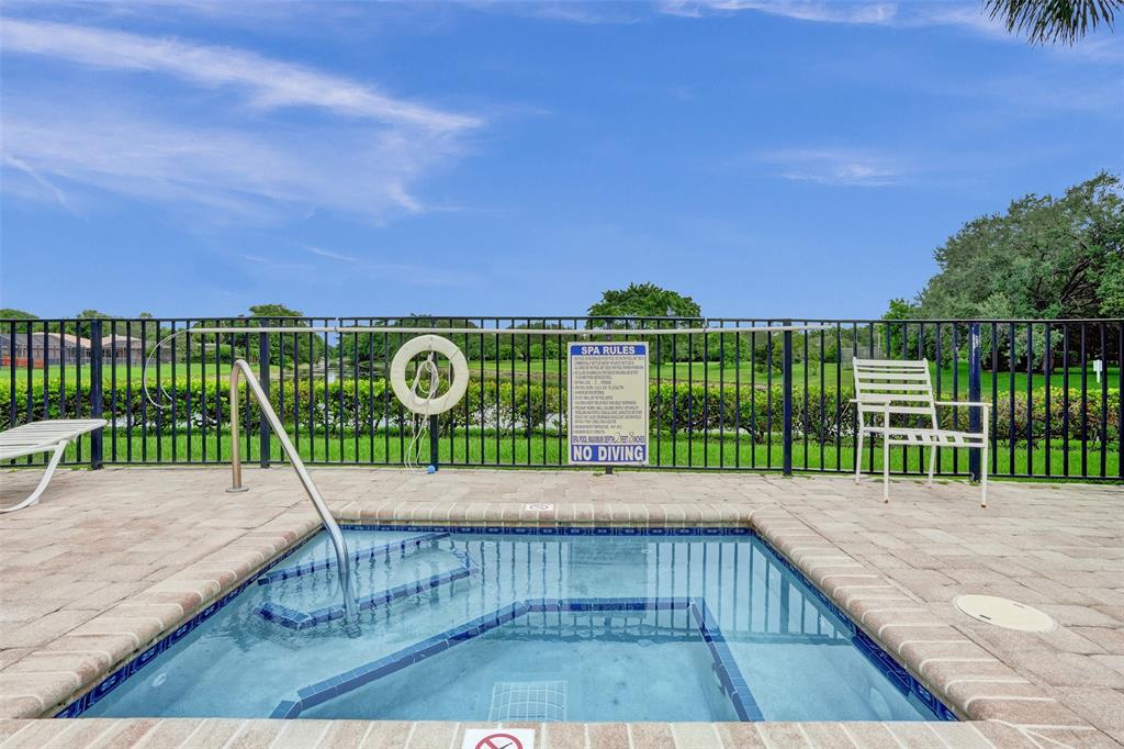 11652 Northwest 19th Drive Coral Springs, FL 33071 - Photo 49 of 52 a view of a wooden deck with a yard
