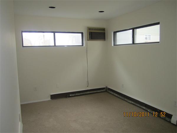 19 Wesley Street Somerville, MA 02145 - Photo 4 of 9 an empty room with a window