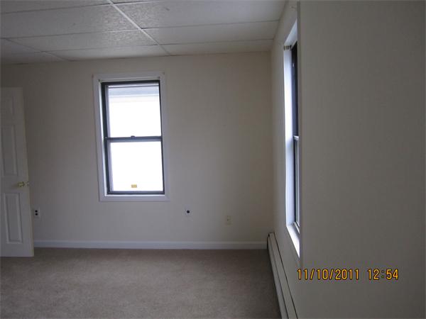 19 Wesley Street Somerville, MA 02145 - Photo 6 of 9 an empty room with a window