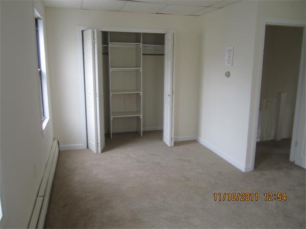 19 Wesley Street Somerville, MA 02145 - Photo 7 of 9 a view of empty room with closet and cabinet