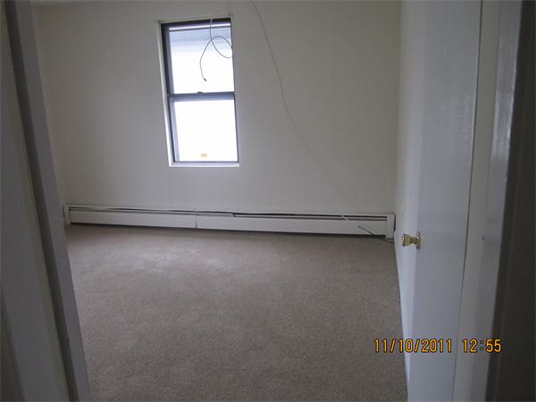 19 Wesley Street Somerville, MA 02145 - Photo 8 of 9 an empty room with a window