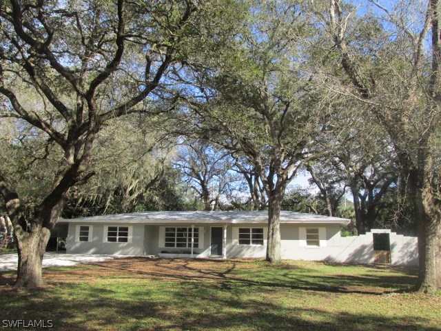 4231 Ellis Road Fort Myers, FL 33905 - Photo 1 of 13 a front view of a house with swimming pool