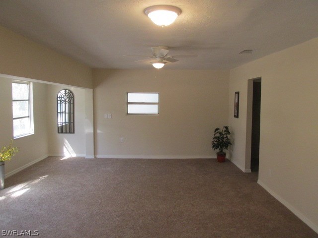 4231 Ellis Road Fort Myers, FL 33905 - Photo 7 of 13 an empty room with windows