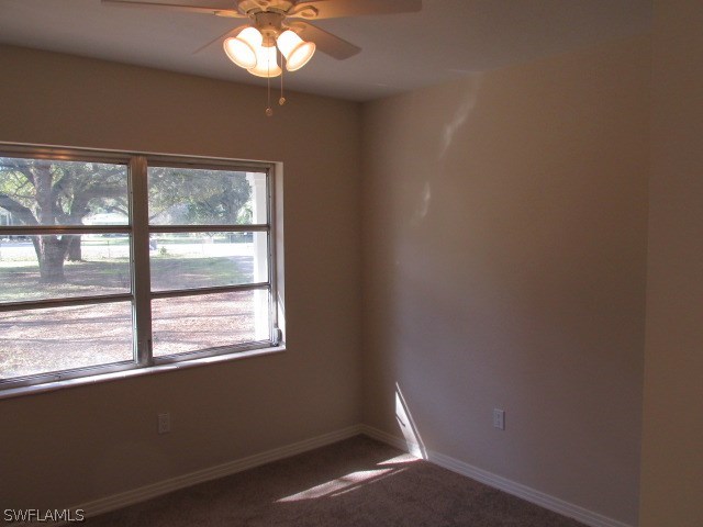 4231 Ellis Road Fort Myers, FL 33905 - Photo 9 of 13 a view of an empty room with a window
