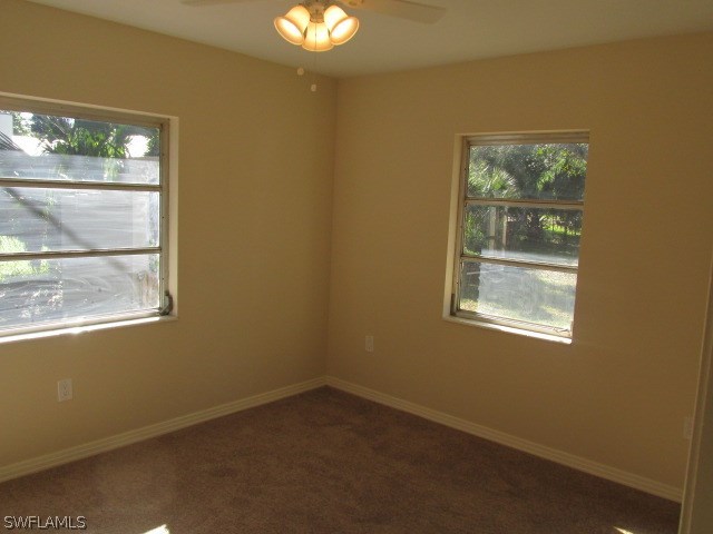 4231 Ellis Road Fort Myers, FL 33905 - Photo 10 of 13 an empty room with a window