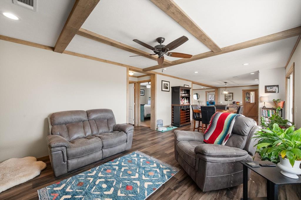216 Southeast County Road Corsicana, TX 75109 - Photo 11 of 37 a living room with furniture and a bookshelf