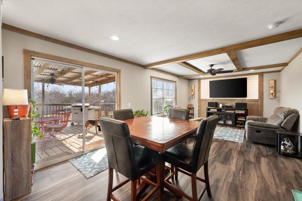216 Southeast County Road Corsicana, TX 75109 - Photo 14 of 37 a view of a dining room with furniture window and wooden floor