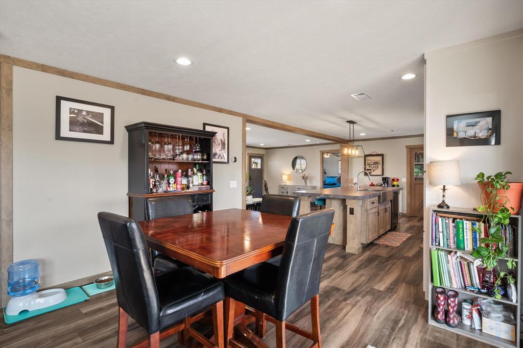 216 Southeast County Road Corsicana, TX 75109 - Photo 16 of 37 a dining room with furniture and wooden floor