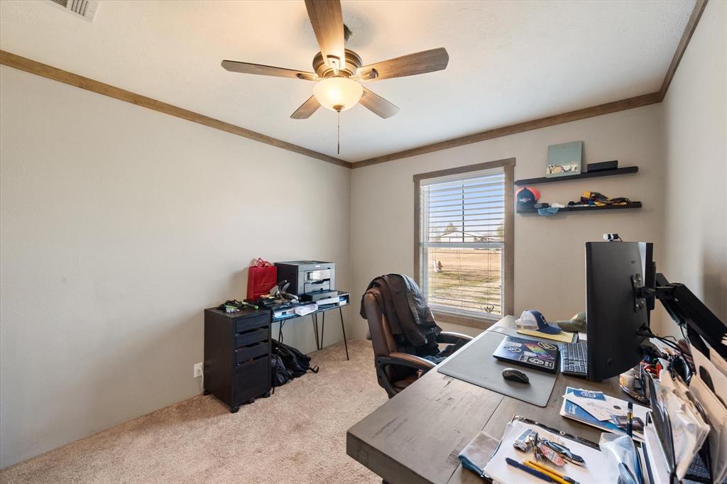 216 Southeast County Road Corsicana, TX 75109 - Photo 26 of 37 a view of a workspace with furniture and a window