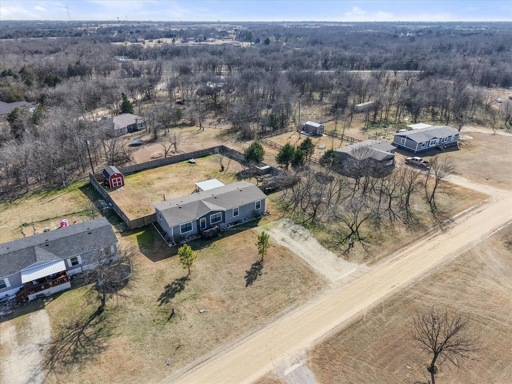 216 Southeast County Road Corsicana, TX 75109 - Photo 27 of 37 an aerial view of a house with a yard and lake view