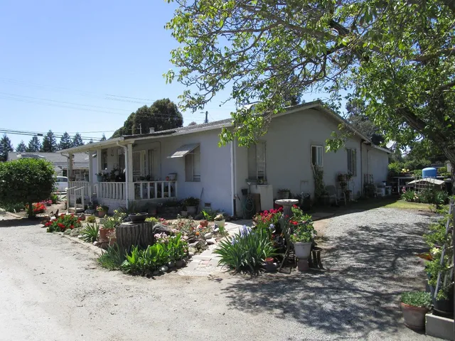a backyard of a house with lots of green space