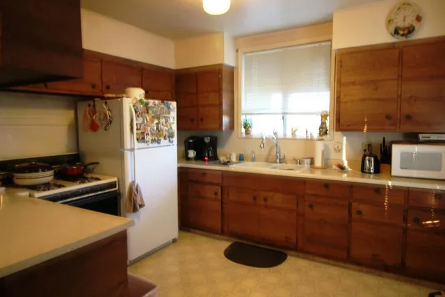 a bedroom with a bed and a mirror