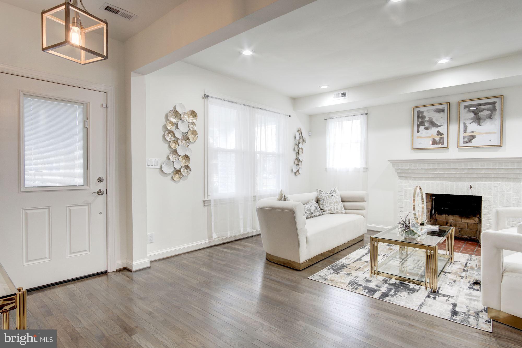 5710 3rd Place Northwest Washington, DC 20011 - Photo 6 of 53 Gleaming Hardwood Flooring and Amber Lighting