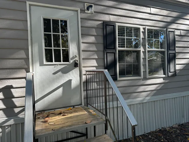 a view of balcony with a potted plant
