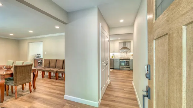 a bedroom with a bed and flat tv screen on the dresser