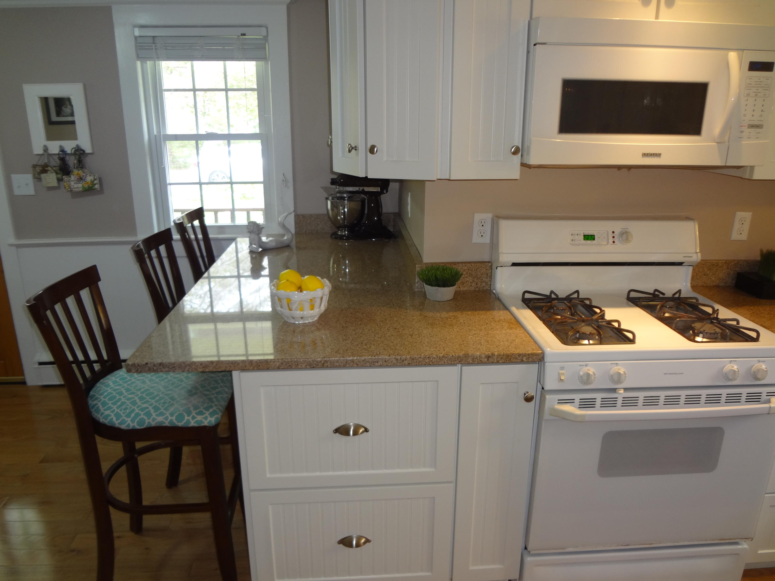59 Old Post Road Centerville, MA 02632 - Photo 10 of 28 kitchen breakfast bar opposite A