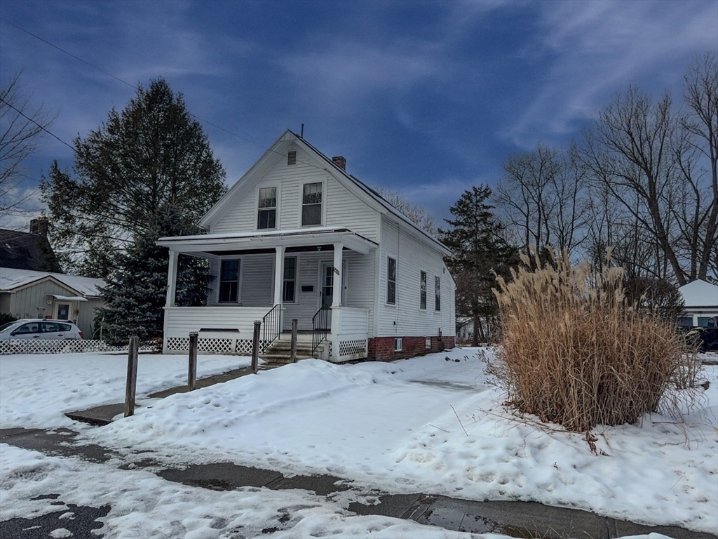 360 Davis Street Greenfield, MA 01301 - Photo 29 of 32 a view of a white house with a yard covered in snow