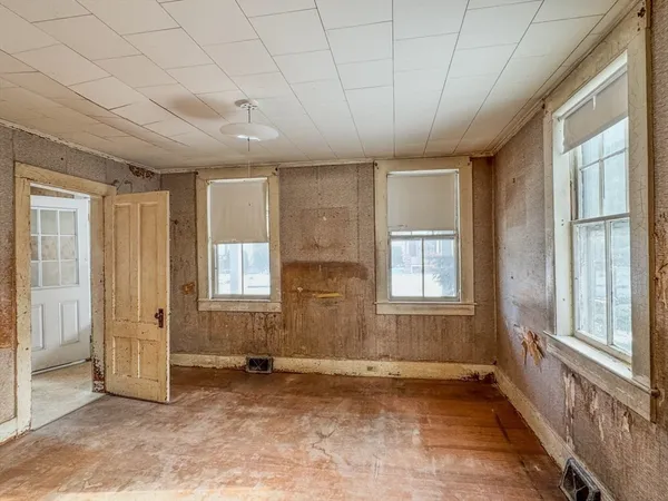 a view of an empty room with a window