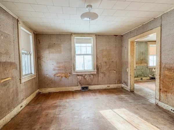 a view of an empty room with a window