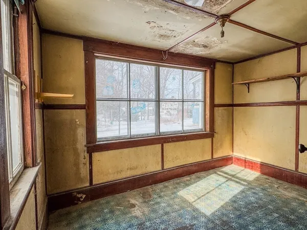 a view of a room with windows