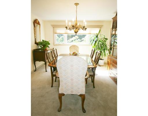 27 Richard Road Needham, MA 02492 - Photo 5 of 10 a dining room with furniture and a chandelier