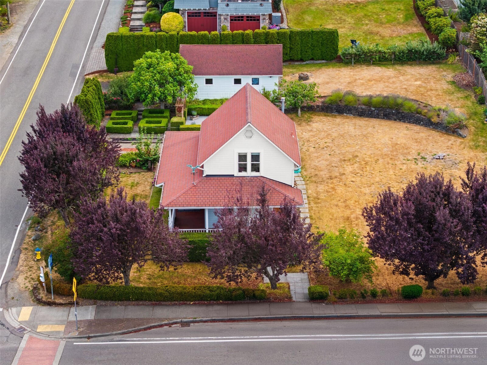 3414 Harborview Drive Gig Harbor, WA 98332 - Photo 2 of 40 front view of house with a yard and swimming pool
