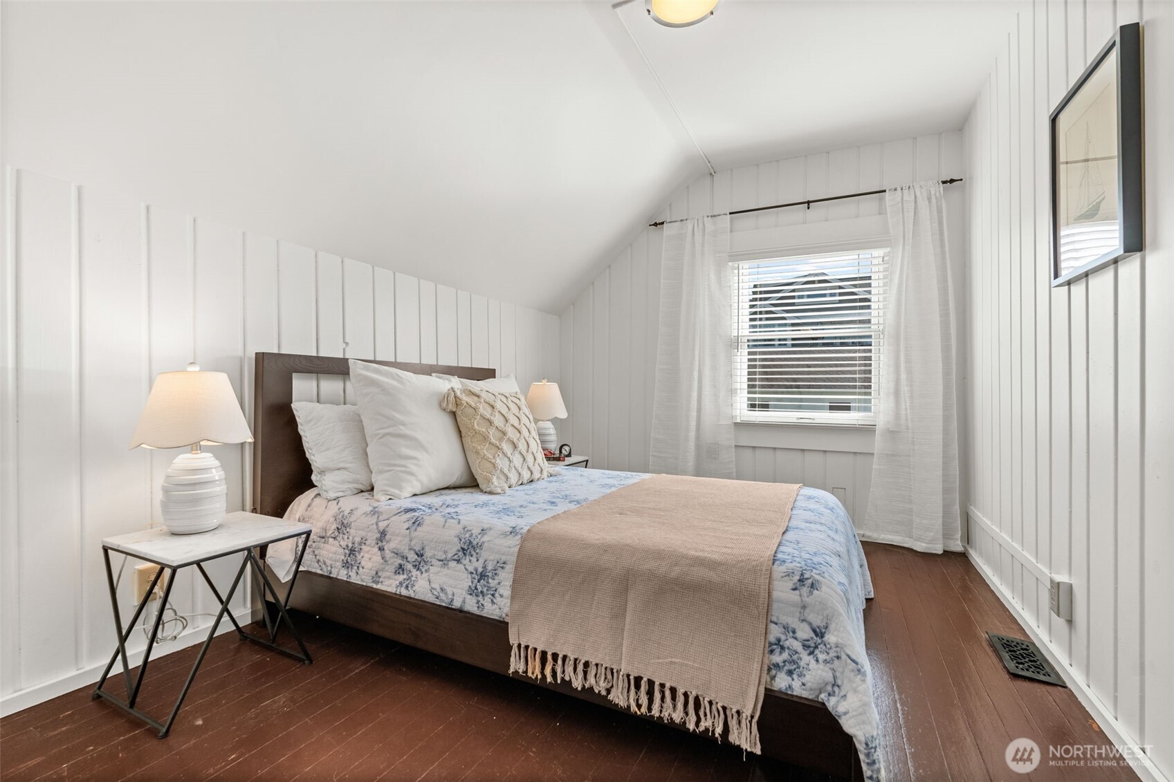 3414 Harborview Drive Gig Harbor, WA 98332 - Photo 32 of 40 a bedroom with a bed a chair and a large window