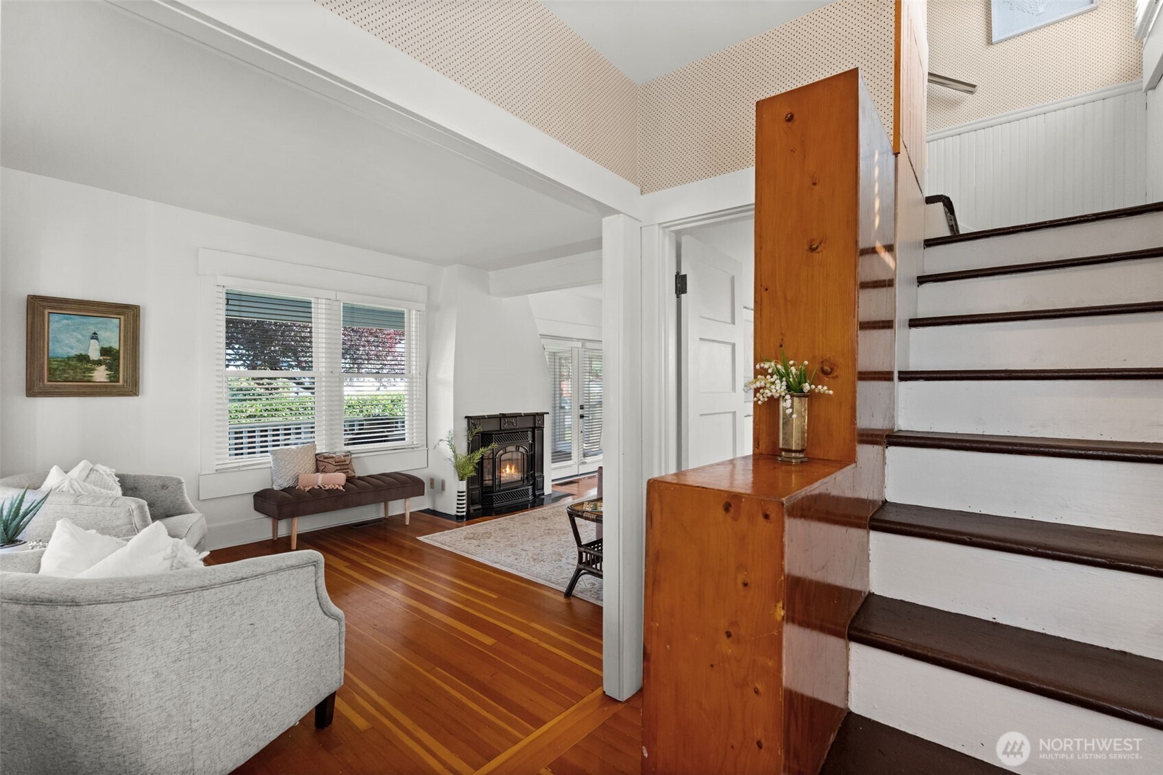 3414 Harborview Drive Gig Harbor, WA 98332 - Photo 8 of 40 a living room with furniture a fireplace and a window