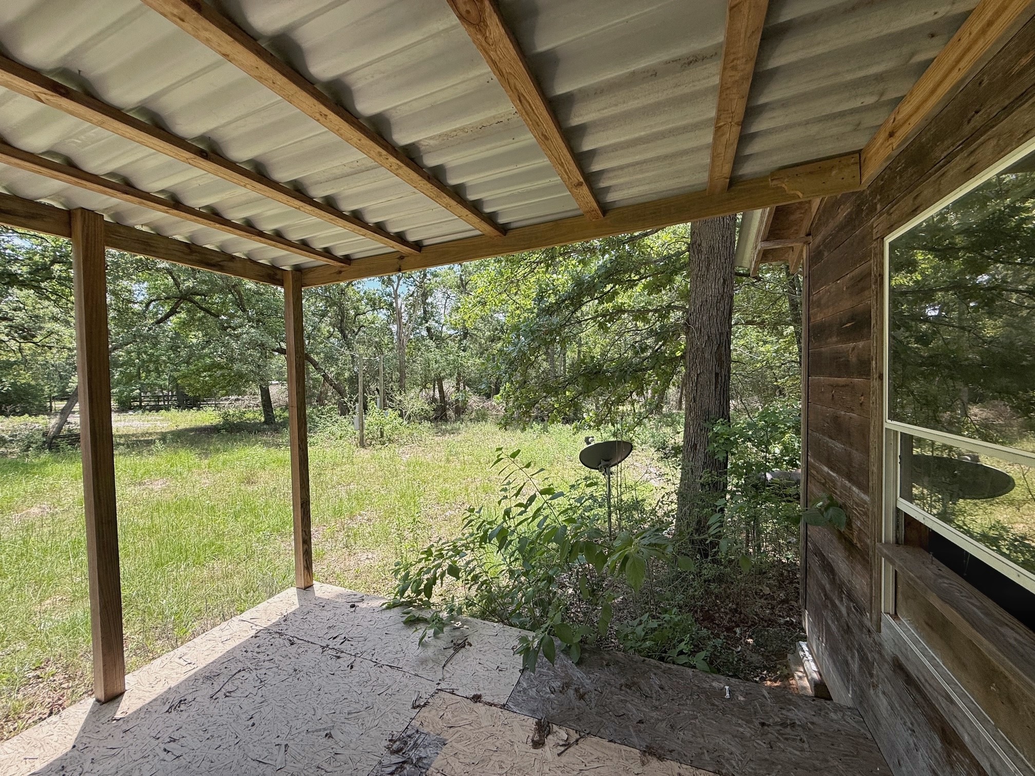 1491 County Road 1464 Centerville, TX 75833 - Photo 11 of 19 a view of a porch with a big yard