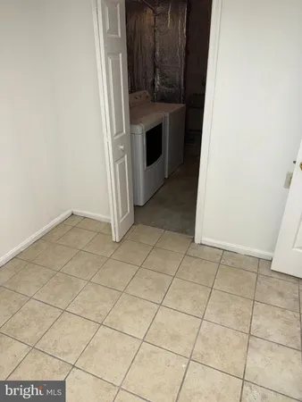 a view of an empty room with cabinet