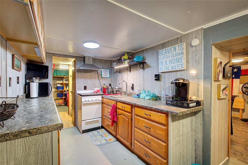 8 Lots Prairie Yantis, TX 75497 - Photo 11 of 26 a kitchen with stainless steel appliances granite countertop a sink stove and refrigerator